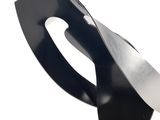 a black and white sculpture of a knife on a table