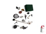 a lot of items that are laying out on a white surface