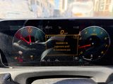 a car dashboard with a speedometer and gauges on it