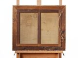 an old wooden easel with a painting on top of it on a white background