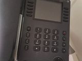 a telephone that is sitting on top of a desk