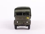 a toy army truck that is sitting on a white surface