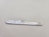 a close up of a toothbrush on a white surface