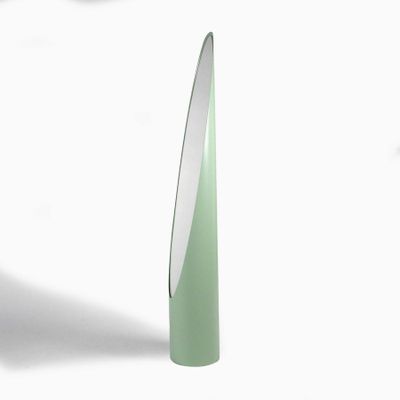 a green vase with a white top on a white surface