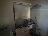 a small kitchen with a stove, sink, and refrigerator
