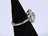 an image of a diamond ring on a black ring holder