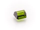 a green tourmaline stone on a white background