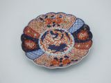 a plate with a design on it sitting on a table