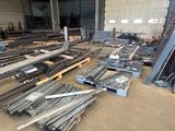 many pieces of metal in a large warehouse