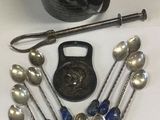 a lot of silver spoons and a bowl on the table
