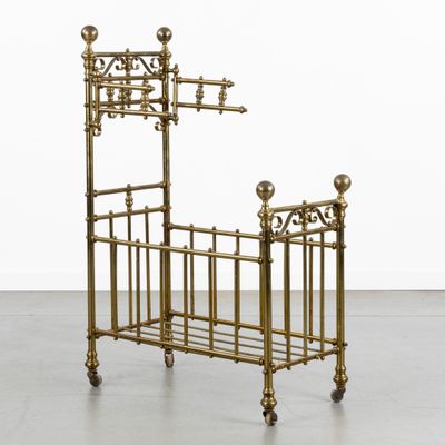 a brass bed with a metal frame and a metal headboard