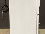 an image of a white cabinet with wires attached to it