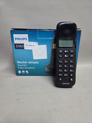 un téléphone posé à côté d'une boîte