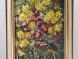 une peinture à l'huile représentant un bouquet de fleurs dans un vase posé sur un chevalet