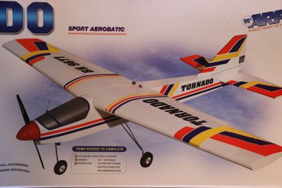 a box with a model of a small airplane in it
