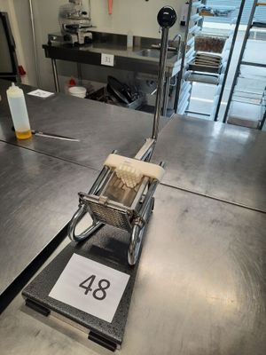 an image of a commercial kitchen with a lot of counter space