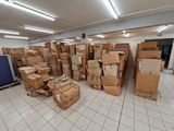 many boxes stacked on top of each other in a room