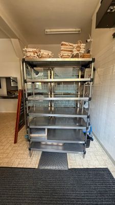 many shelves in the kitchen that have food on them