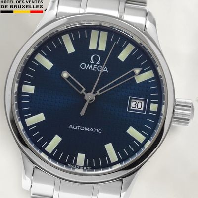 a close up of a watch on a white surface
