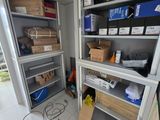 a room with a lot of boxes and boxes on the shelves