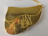 a picture of a gold purse with a monogram on it