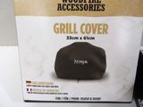 a box of grill cover sitting on a table