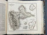 an open book with a map of the island of new york on it