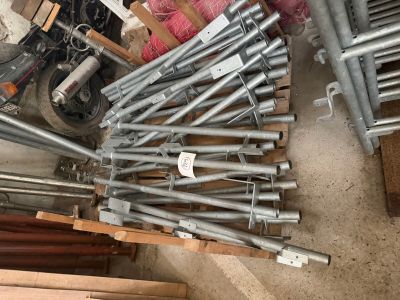 a pile of metal pipes sitting on the ground