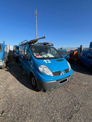 a blue van that is parked in a parking lot