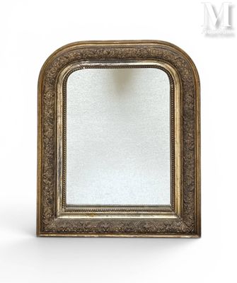 a gold framed mirror with a white background and a white background