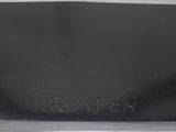 a close up of a black leather wallet with a name engraved on it