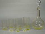 five glasses and a decanter on the table