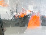 a painting of an orange object in a glass case