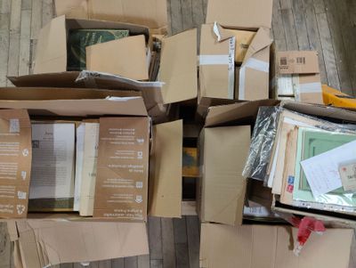 a pile of boxes that are sitting on the floor