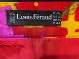 the label of a louis kraud jacket is shown on the back of it