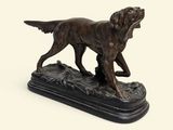 bronze statue of a dog on a black base