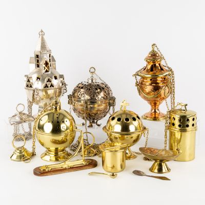 many different types of brass objects on a white surface