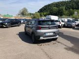 many cars parked in a parking lot in a lot