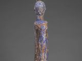 a statue of a woman in a blue dress with a crown on her head
