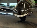a close up of a car ' s side mirror with a reflection on it