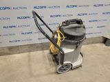 an image of a vacuum cleaner is sitting on the floor