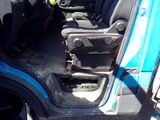 an image of a car door with the driver ' s seat open