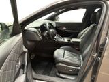 the interior of a car with the door open and the driver ' s seat up