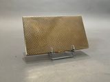 an image of a gold purse sitting on a table