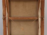 an old wooden easel with a piece of paper on top of it