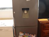 a refrigerator and a dishwasher in a kitchen