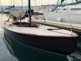 a boat that is docked in the water at the dock