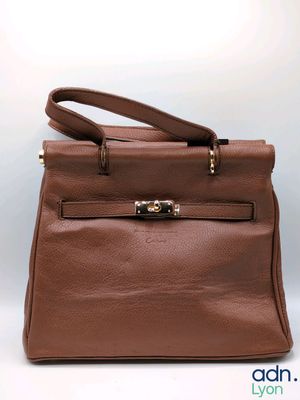 an image of a brown leather handbag on a white background