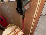 an image of a bathroom with a toilet and a vacuum