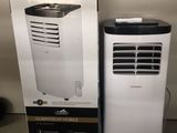 a white air conditioner sitting next to a black and white box